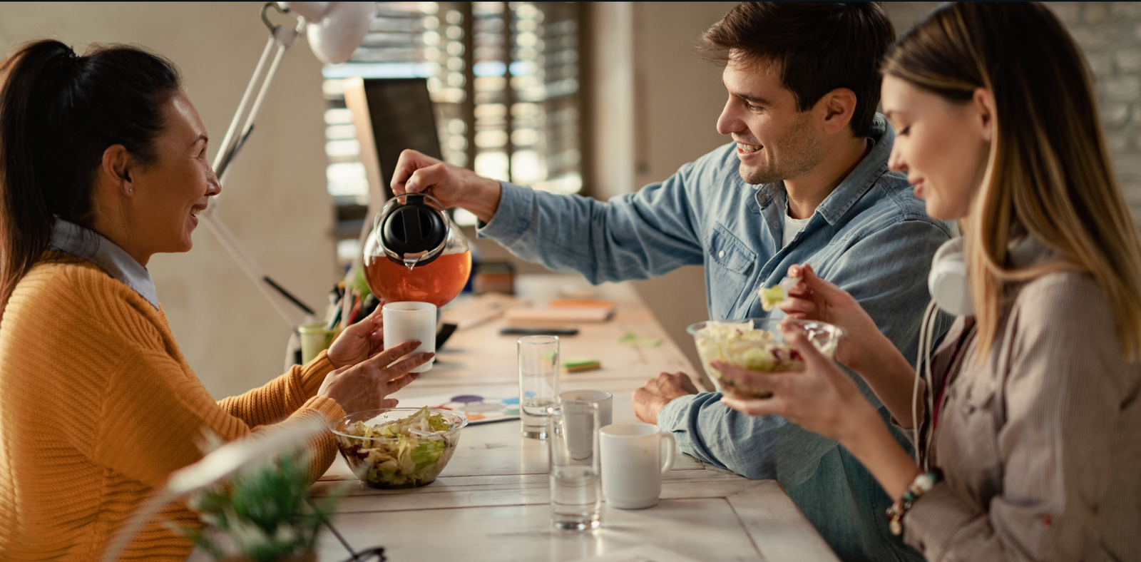 Coworkers enjoying a healthy lunch at Let’s Connect, a modern office space in Noida designed to promote wellness and collaboration