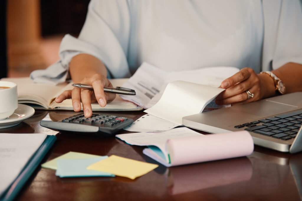 Professional working on utility bills and documents, showcasing how Lets Connect virtual office space in Noida helps businesses with NOC and utility bill support