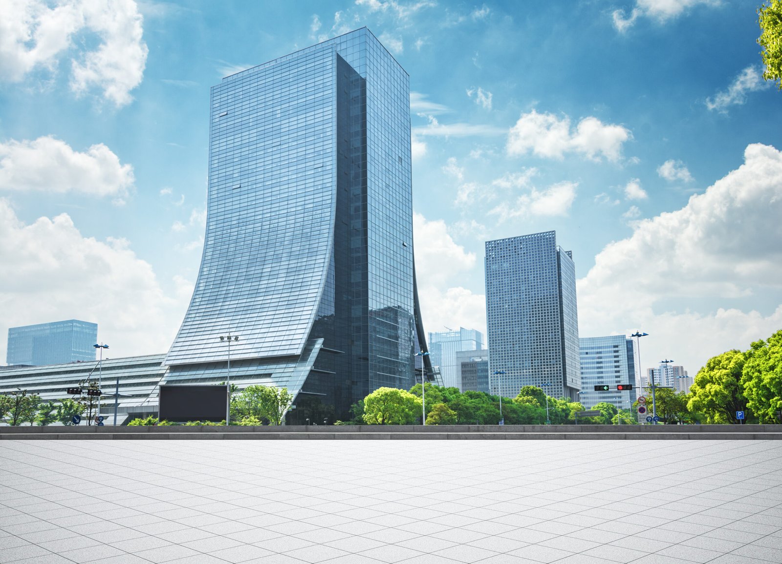 Modern glass office tower representing office rentals near Advant Tower vicinity Sector 142